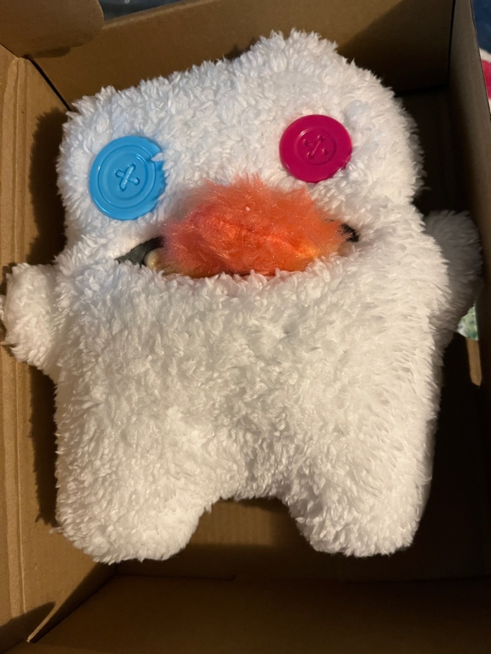 Plush White Monster Toy with Pink and Blue Button Eyes and Orange Nose